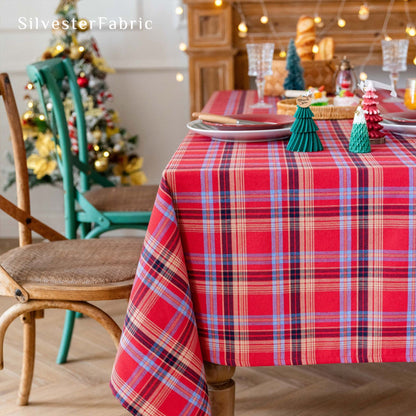 red Christmas tartan plaid cotton tablecloth laid flat on dining table