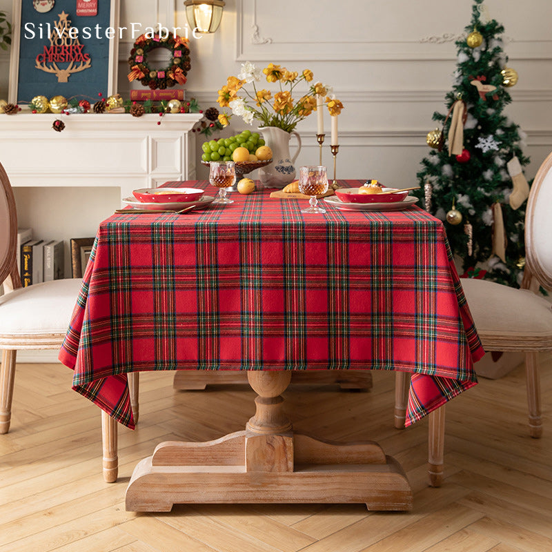 Red Christmas tartan plaid cotton tablecloth draped over rectangle table