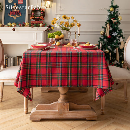 Red Christmas tartan plaid cotton tablecloth draped over rectangle table