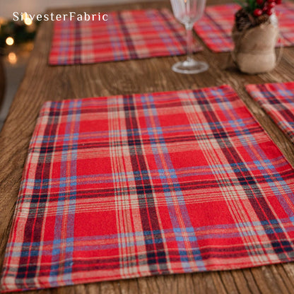 red Christmas plaid placemats laid flat on dining table