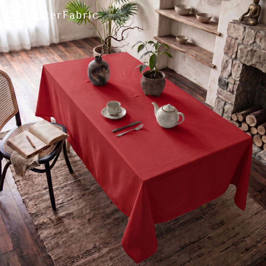 solid red rectangle tablecloth draped over rectangle table