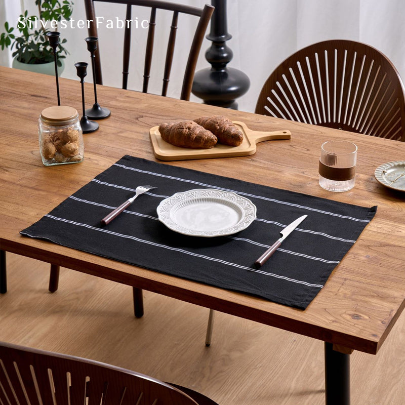 black farmhouse striped placemats laid flat on dining table
