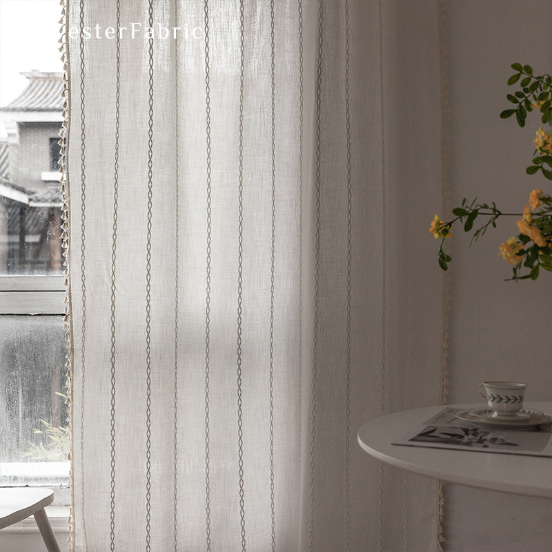 White curtains hanging in the bedroom window