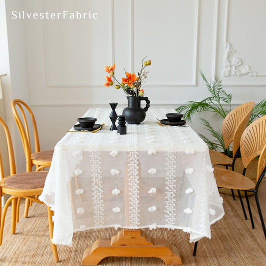 white French tufted tablecloth laid flat on dining table