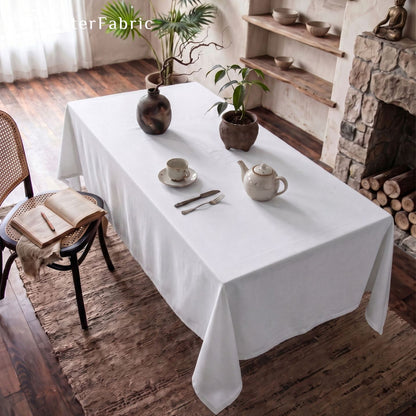 solid white rectangle tablecloth draped over rectangle table