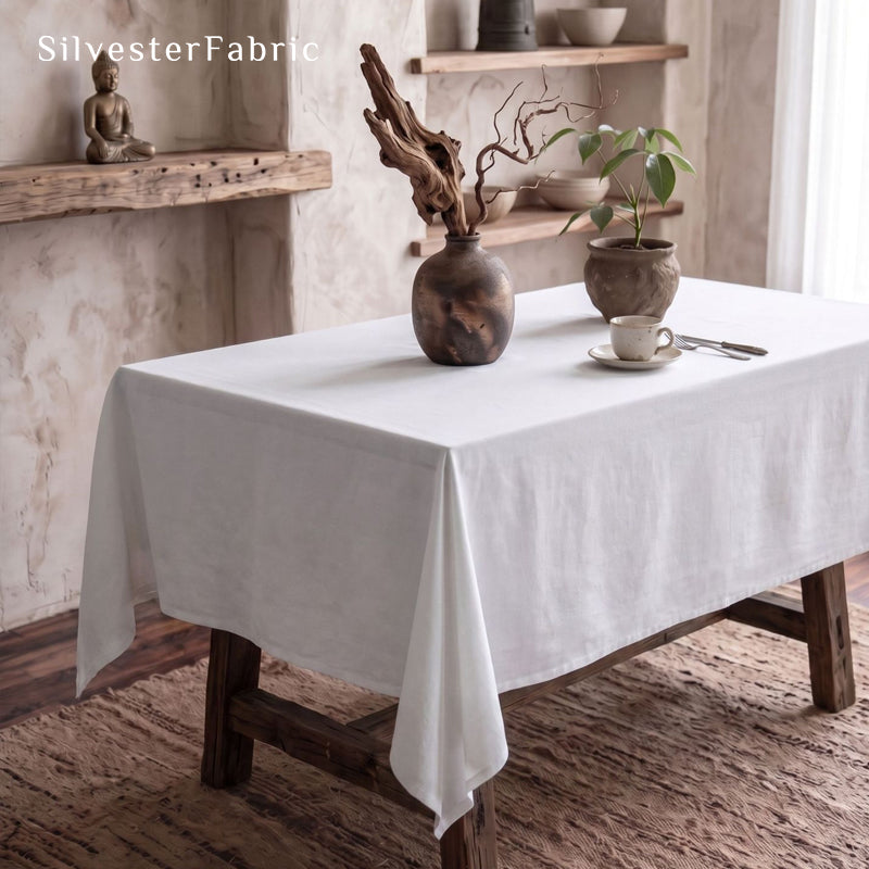 solid white rectangle tablecloth laid flat on dining table
