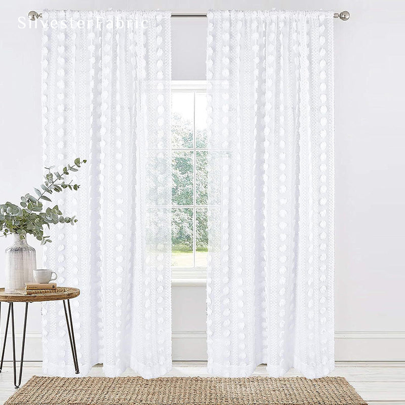 White sheer curtains hanging in the living room window