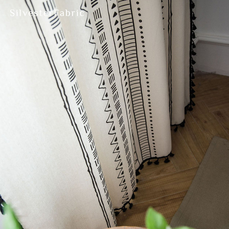 White geometric line linen curtains hanging in the bedroom window