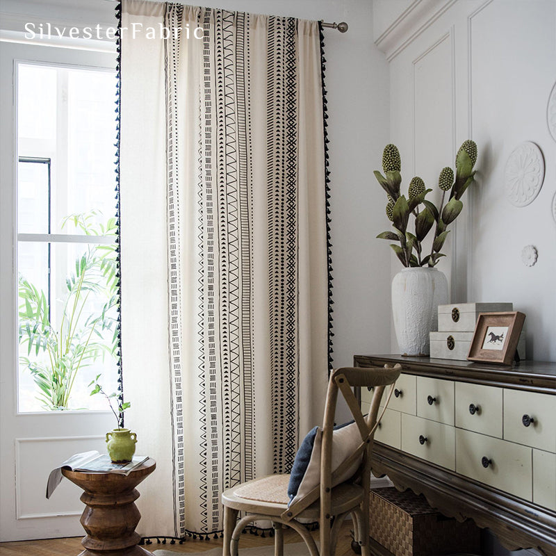 White geometric line linen curtains hanging in the bedroom window