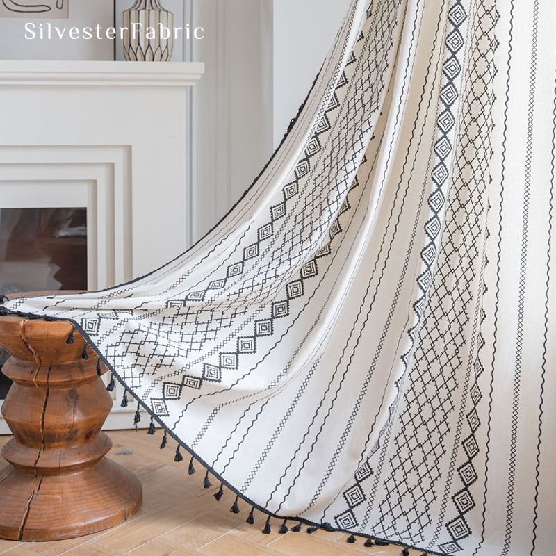 White geometric line linen curtains hanging in the bedroom window