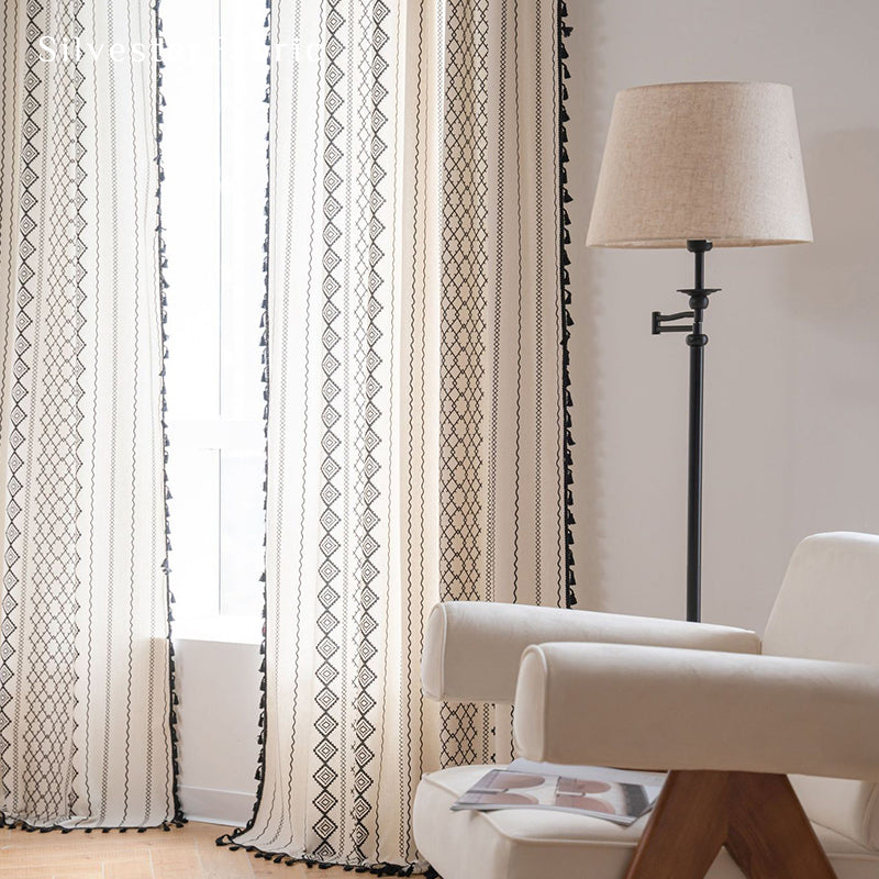 White geometric line linen curtains hanging in the bedroom window