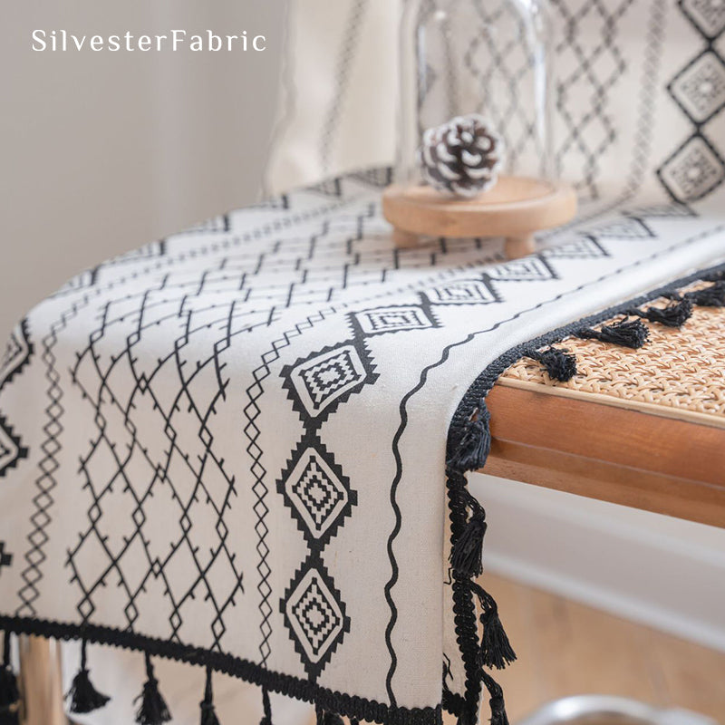 White geometric line linen curtains hanging in the bedroom window