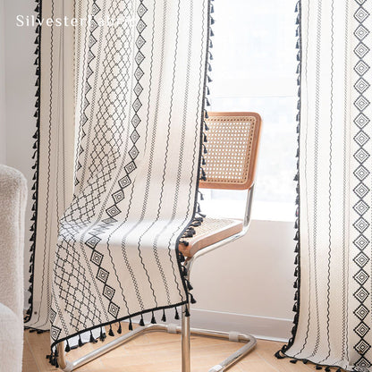 White geometric line linen curtains hanging in the bedroom window