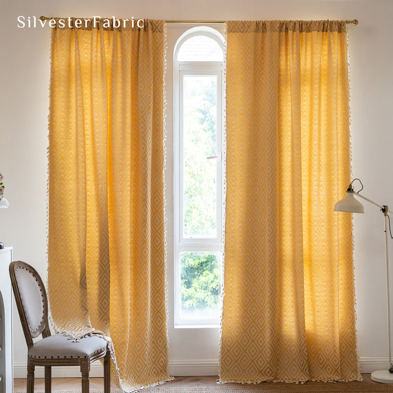 Close‑up of yellow farmhouse diamond curtain corner