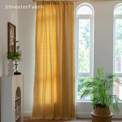 Close‑up of yellow farmhouse curtain corner