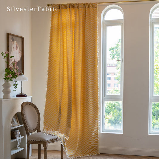 Close‑up of yellow curtain corner