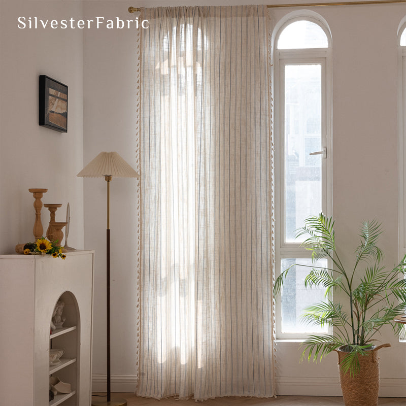 Close‑up of Beige vertical striped curtain corner