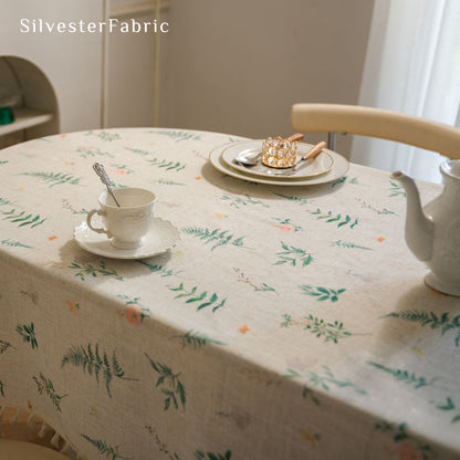 floral farmhouse tablecloth laid flat on dining table