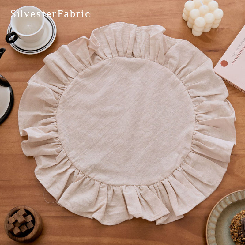 beige farmhouse round placemats styled with plates and napkins