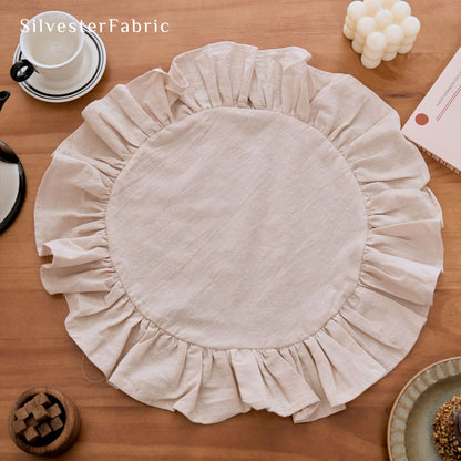 beige farmhouse round placemats styled with plates and napkins