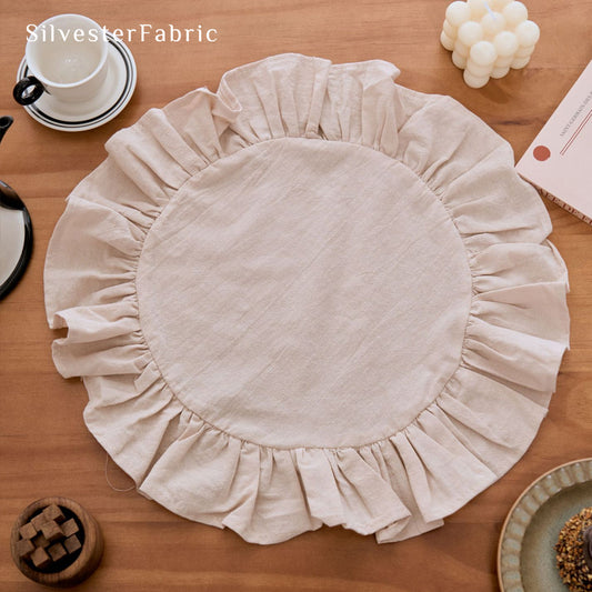 beige farmhouse round placemats styled with plates and napkins