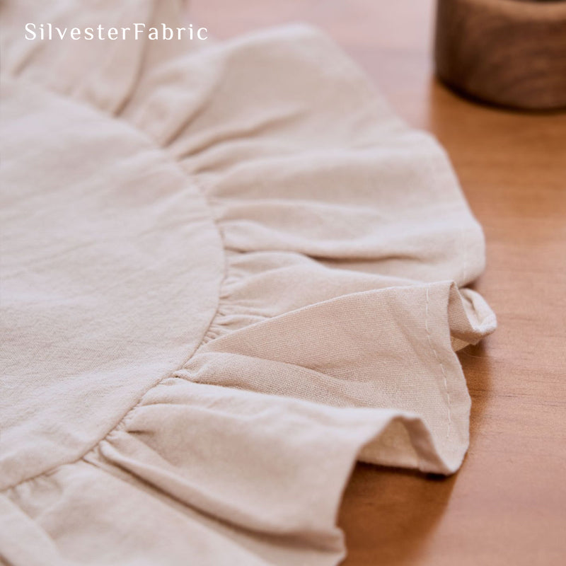 beige farmhouse round placemats fabric close-up