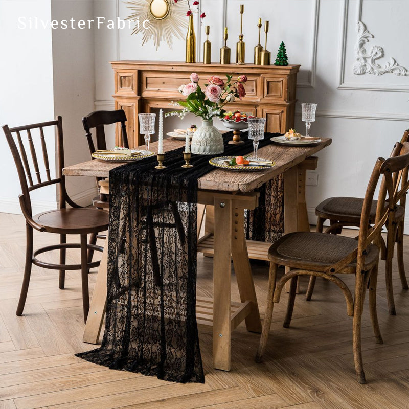 black floral lace table runner draped over rectangle table