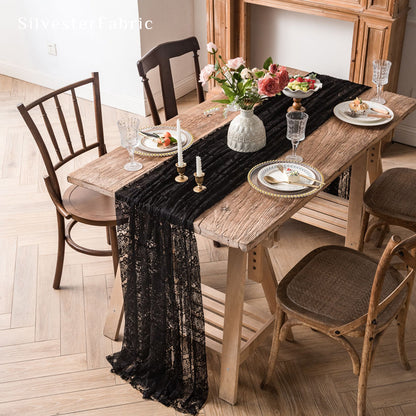 black lace table runner draped over rectangle table
