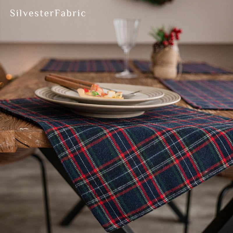 blue Christmas plaid placemats laid flat on dining table