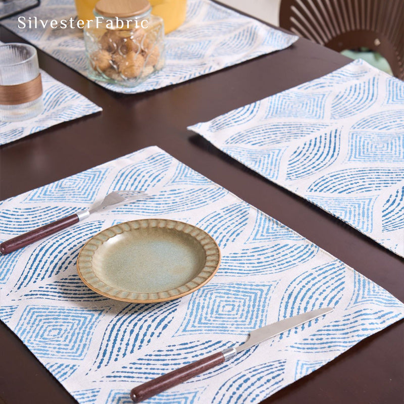 blue textured farmhouse placemats laid flat on dining table