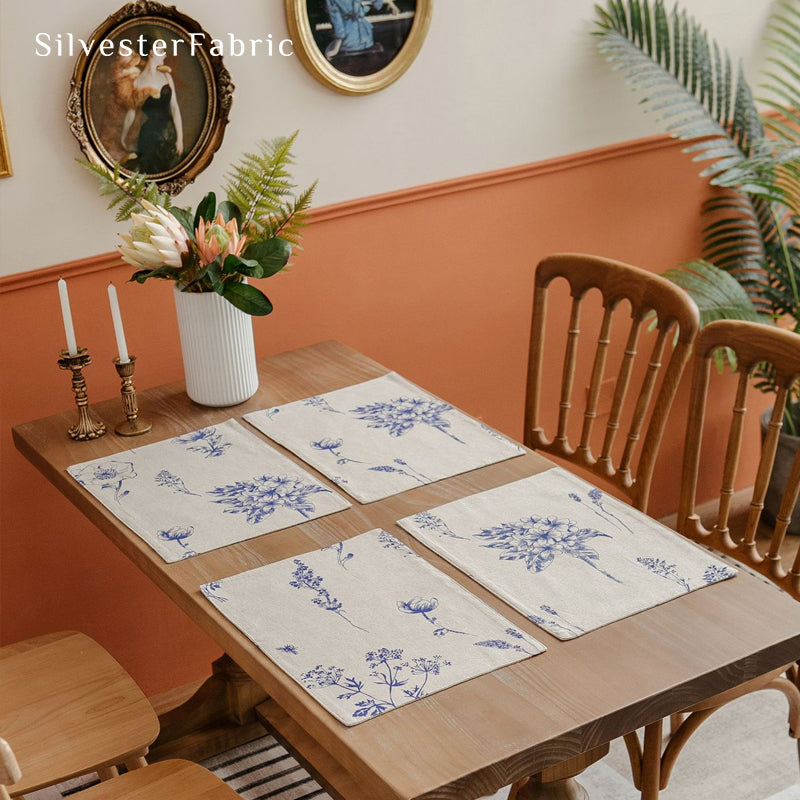 blue floral farmhouse placemats set of 4 arranged on rectangle table