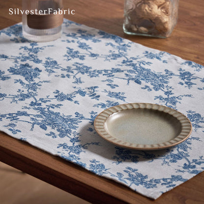 blue floral farmhouse placemats laid flat on dining table