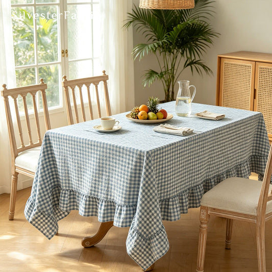 blue plaid farmhouse tablecloth draped over rectangle table