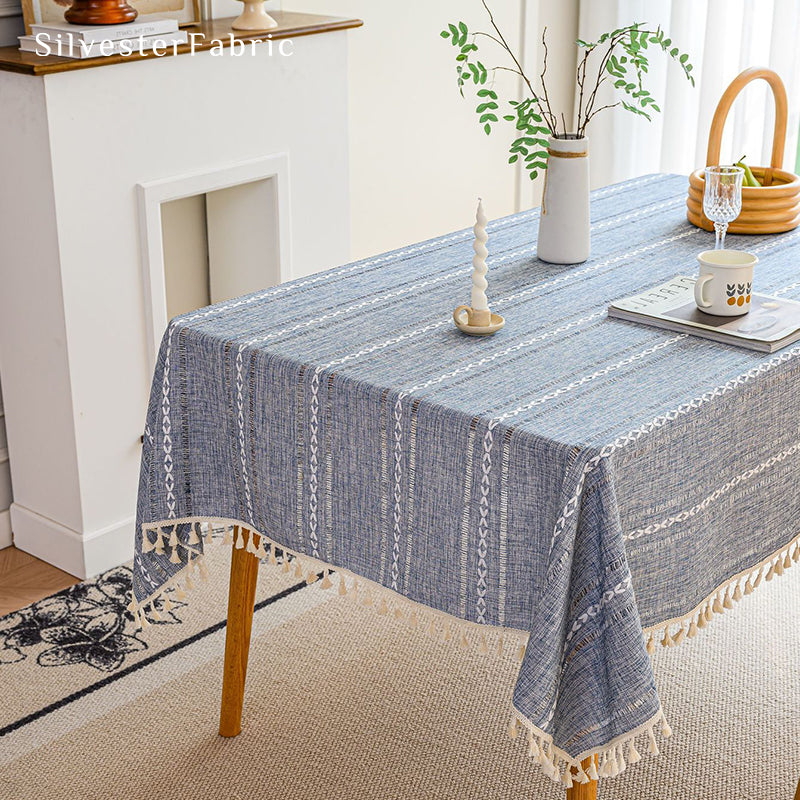 Light blue rectangle tablecloth over wooden table