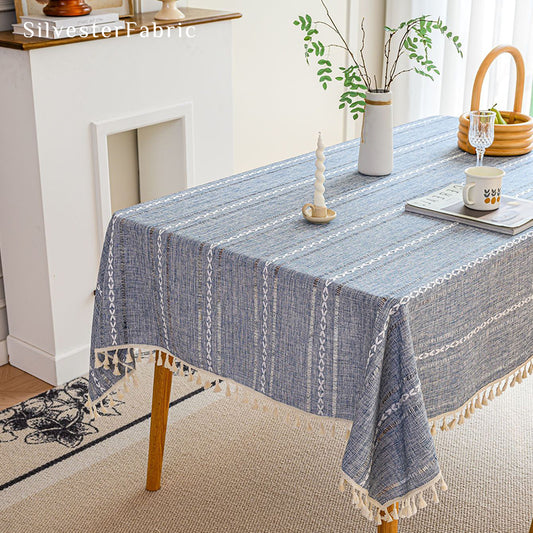 Light blue rectangle tablecloth over wooden table