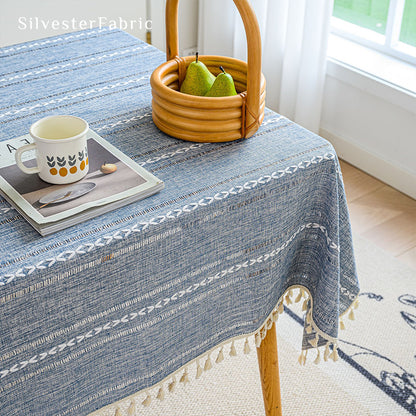 Light blue rectangle tablecloth over wooden table