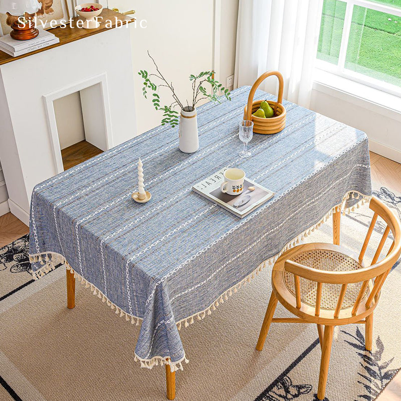 Light blue rectangle tablecloth over wooden table