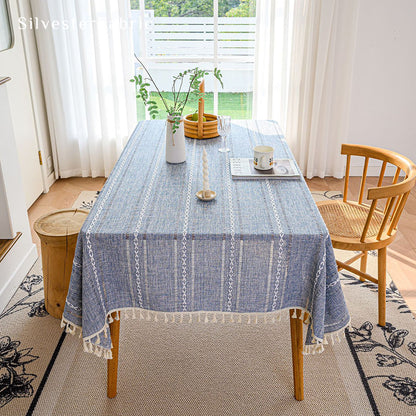 Light blue rectangle tablecloth over wooden table