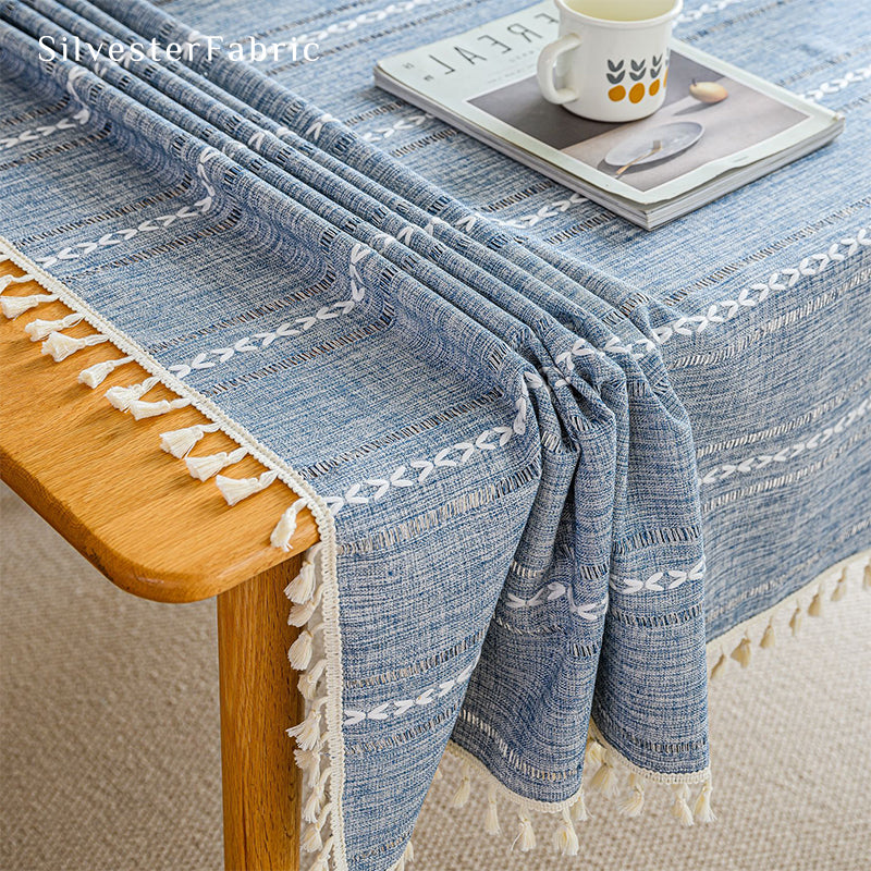 Light blue rectangle tablecloth over wooden table