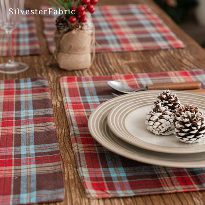 brown Christmas plaid placemats laid flat on dining table