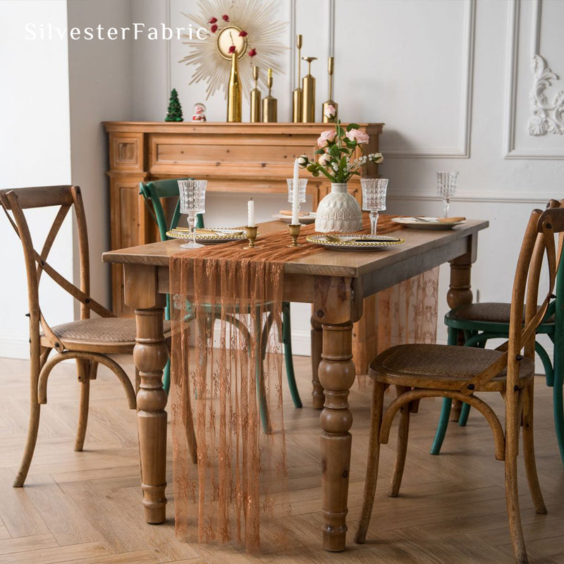 brown lace table runner laid flat on dining table