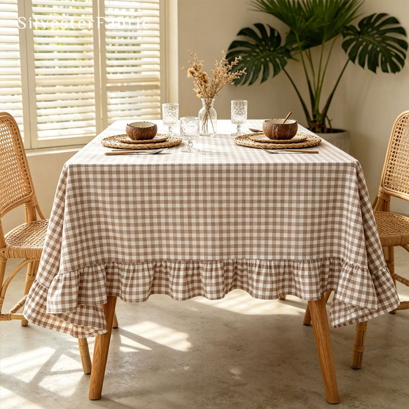 brown plaid farmhouse tablecloth laid flat on dining table
