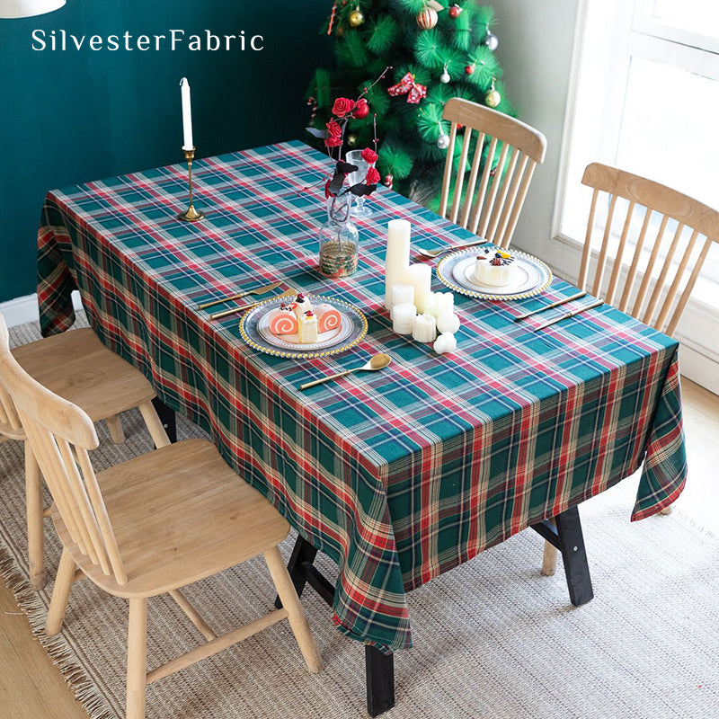 Green plaid Christmas tablecloth covering the table