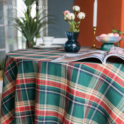 Green plaid Christmas tablecloth covering the table