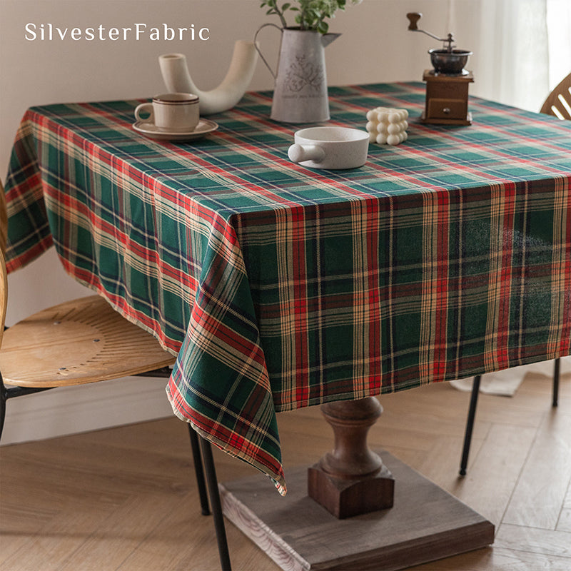 Green plaid Christmas tablecloth covering the table