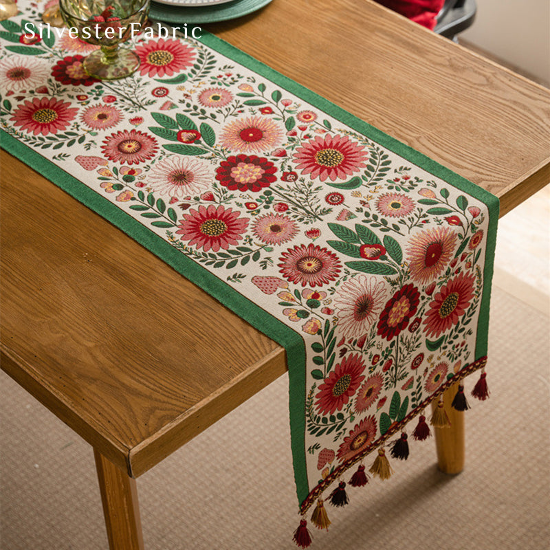 Gorgeous floral table runner in the center of a wooden table