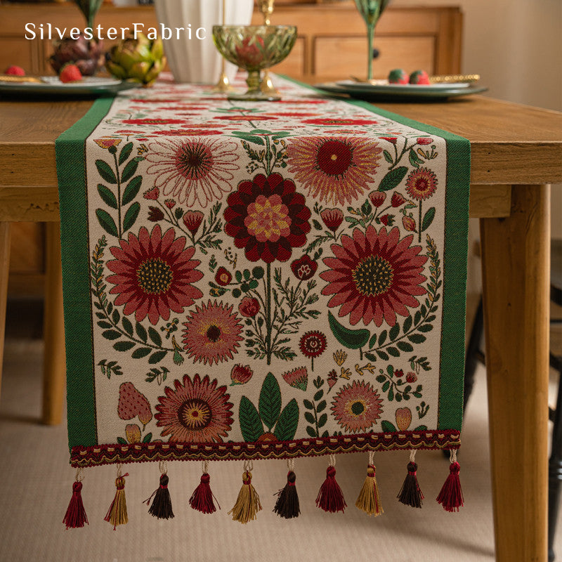 Gorgeous floral table runner in the center of a wooden table