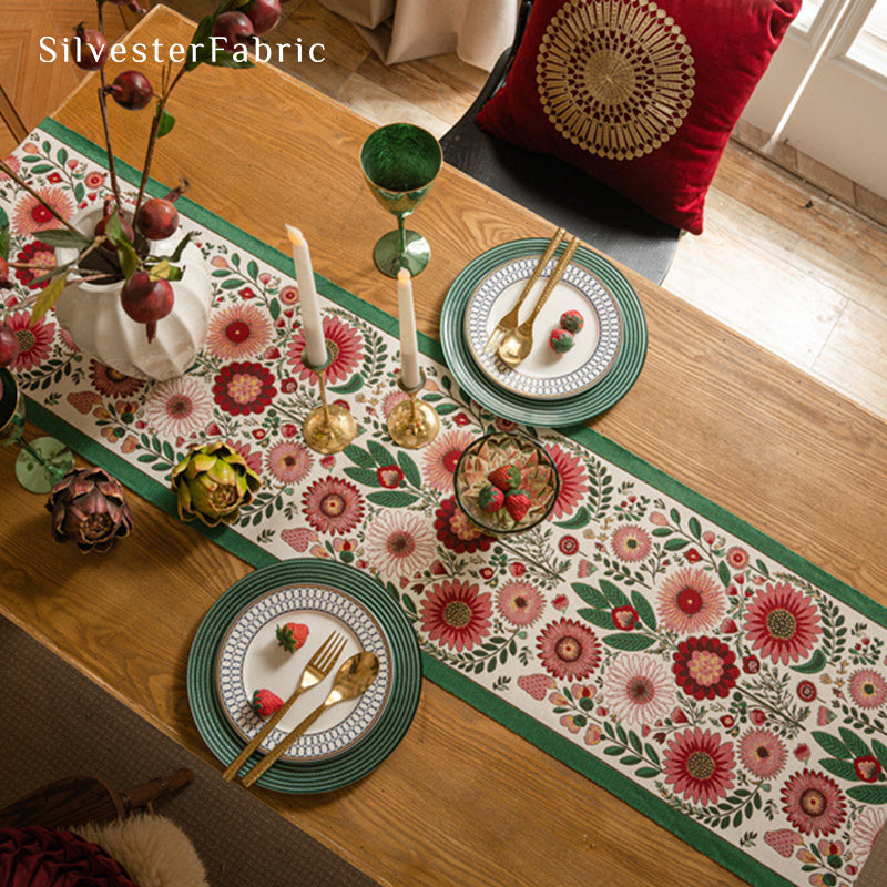 Gorgeous floral table runner in the center of a wooden table