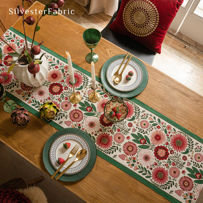 Gorgeous floral table runner in the center of a wooden table