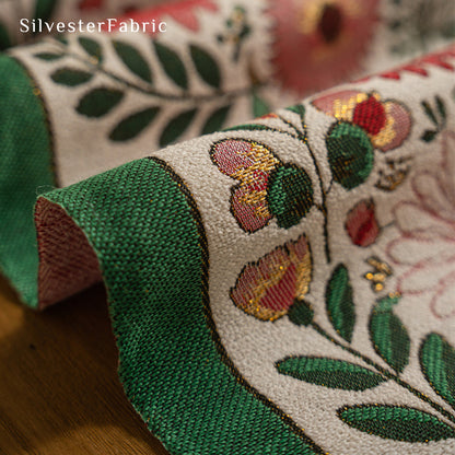 Gorgeous floral table runner in the center of a wooden table